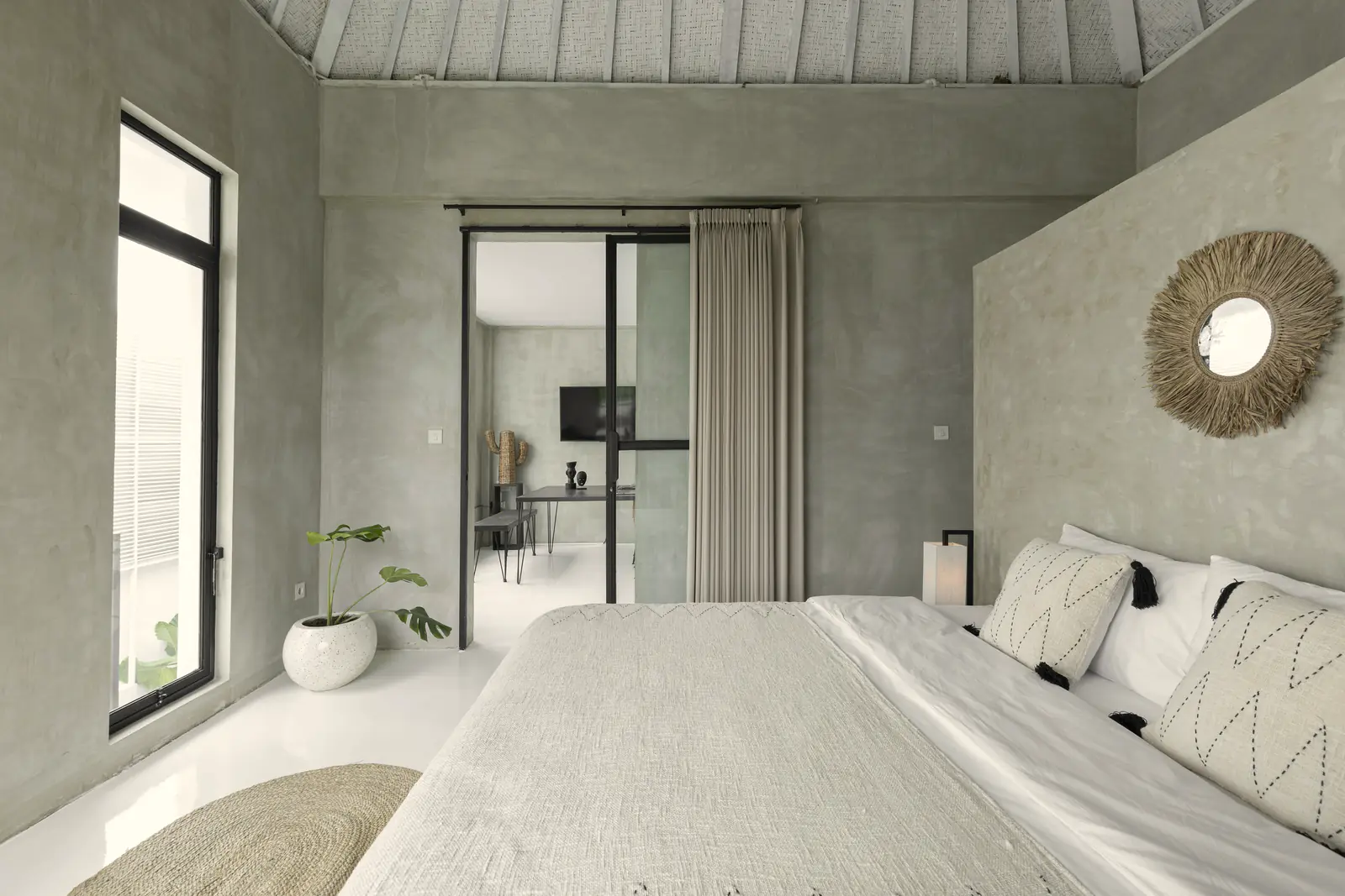 Bright Bali villa bedroom with a few fine pieces
