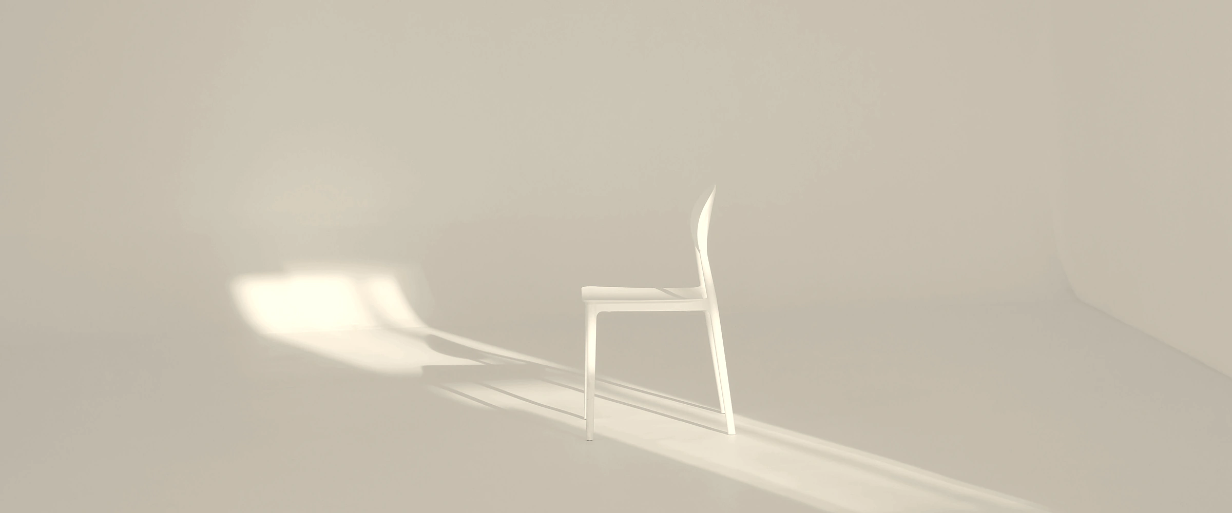 Sculptural white chair in a sunlit room, casting a long shadow